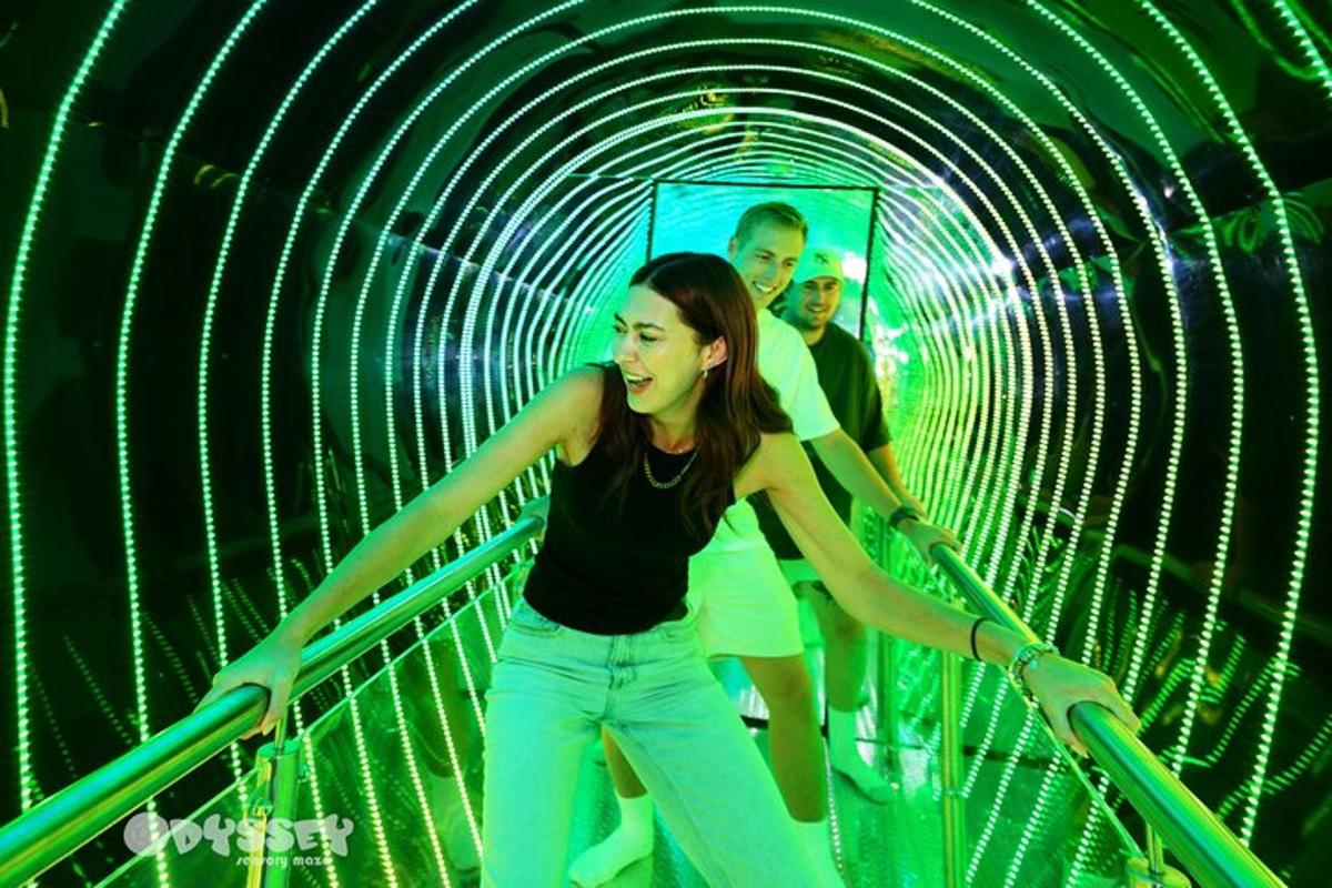a man and a woman walking through a tunnel