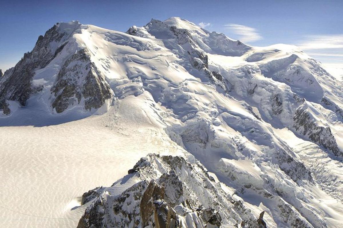 a mountain covered in snow with the top