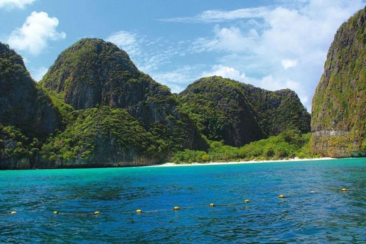 a view of a beach from a boat in the water