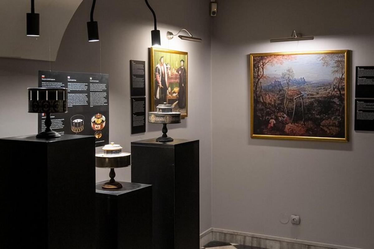 a museum exhibit with a painting on the wall