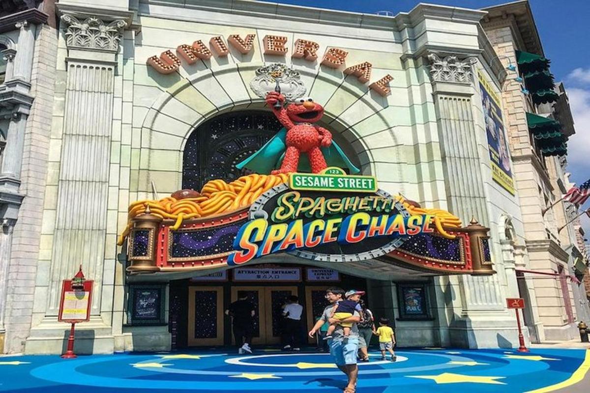 a couple of people standing in front of a theatre