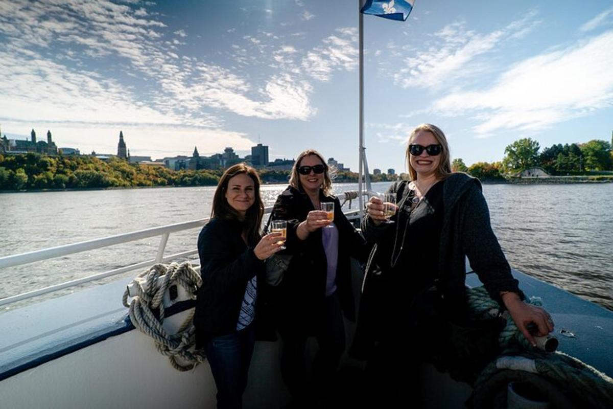 three women sitting on a boat holding glasses of wine