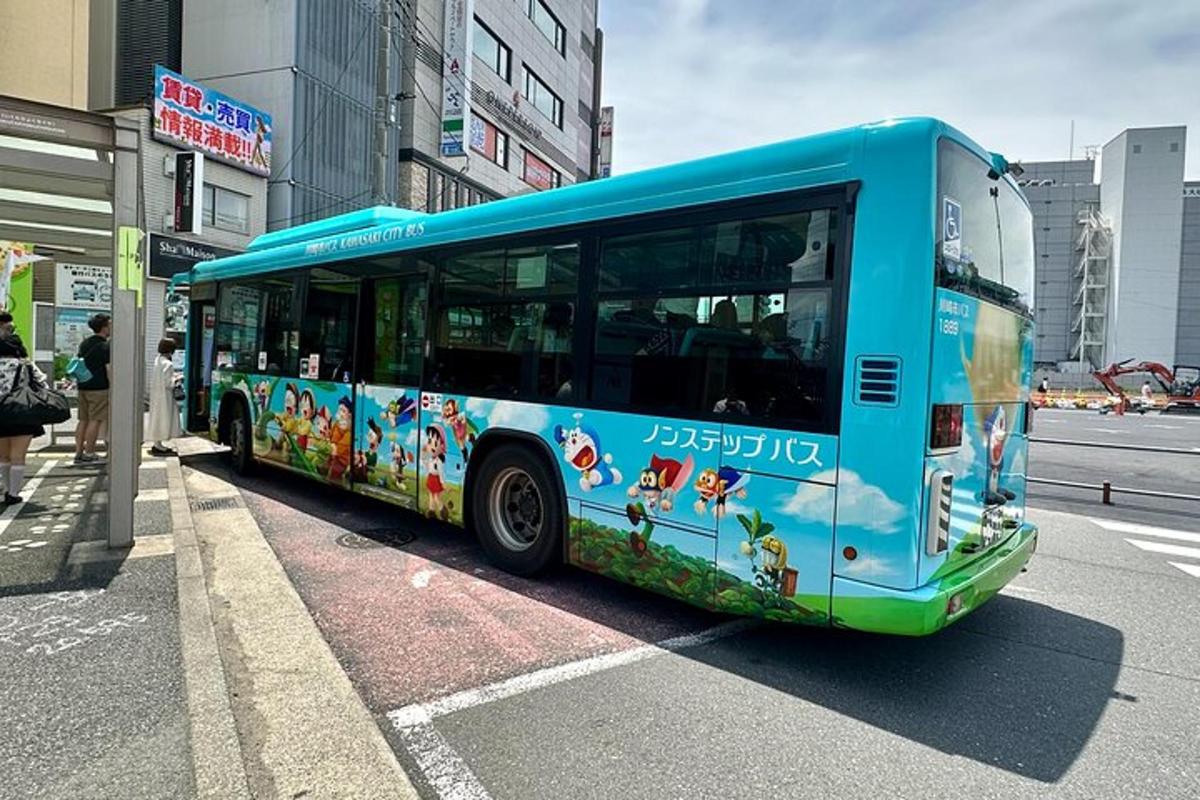 a blue bus parked on the side of a street