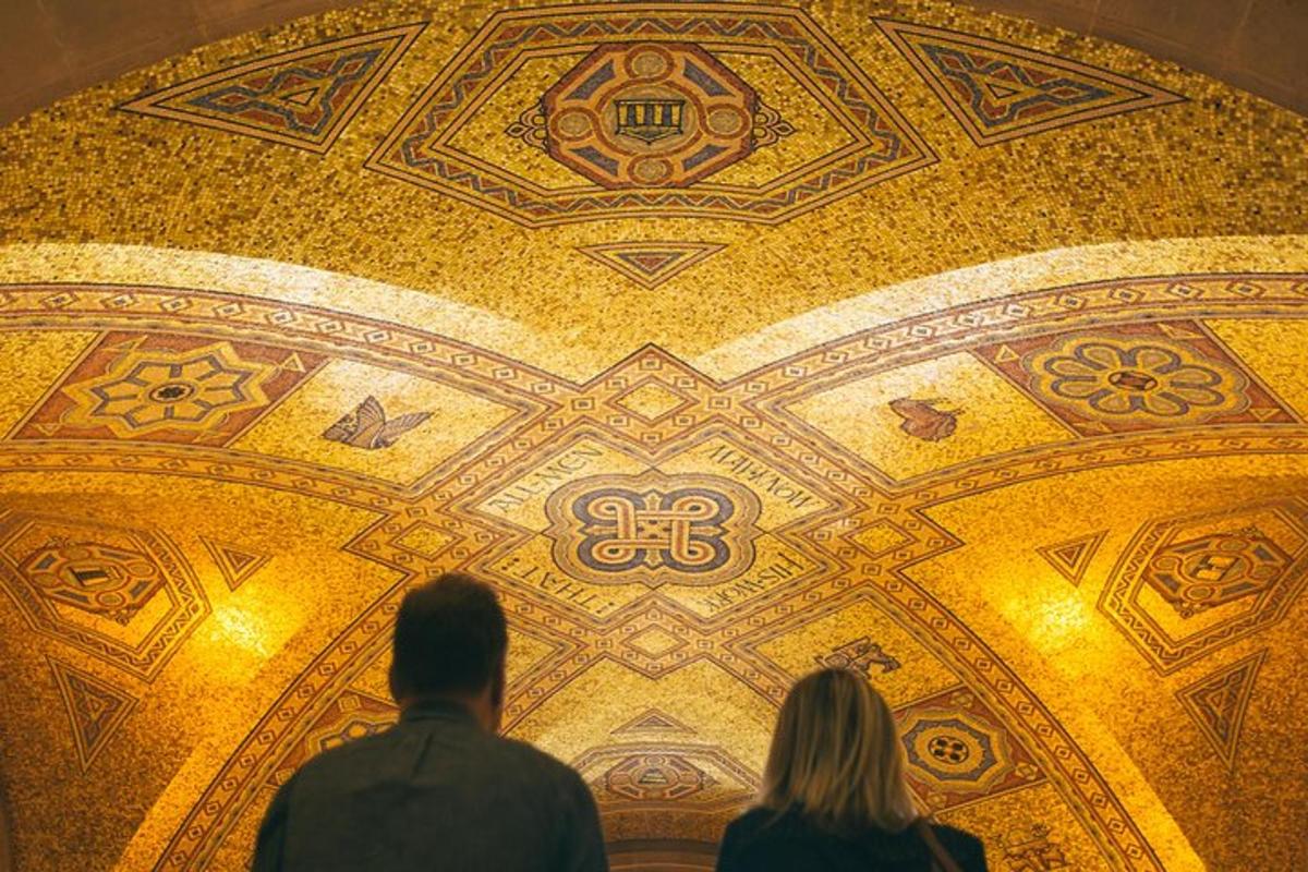 a man and a woman looking at a gold ceiling