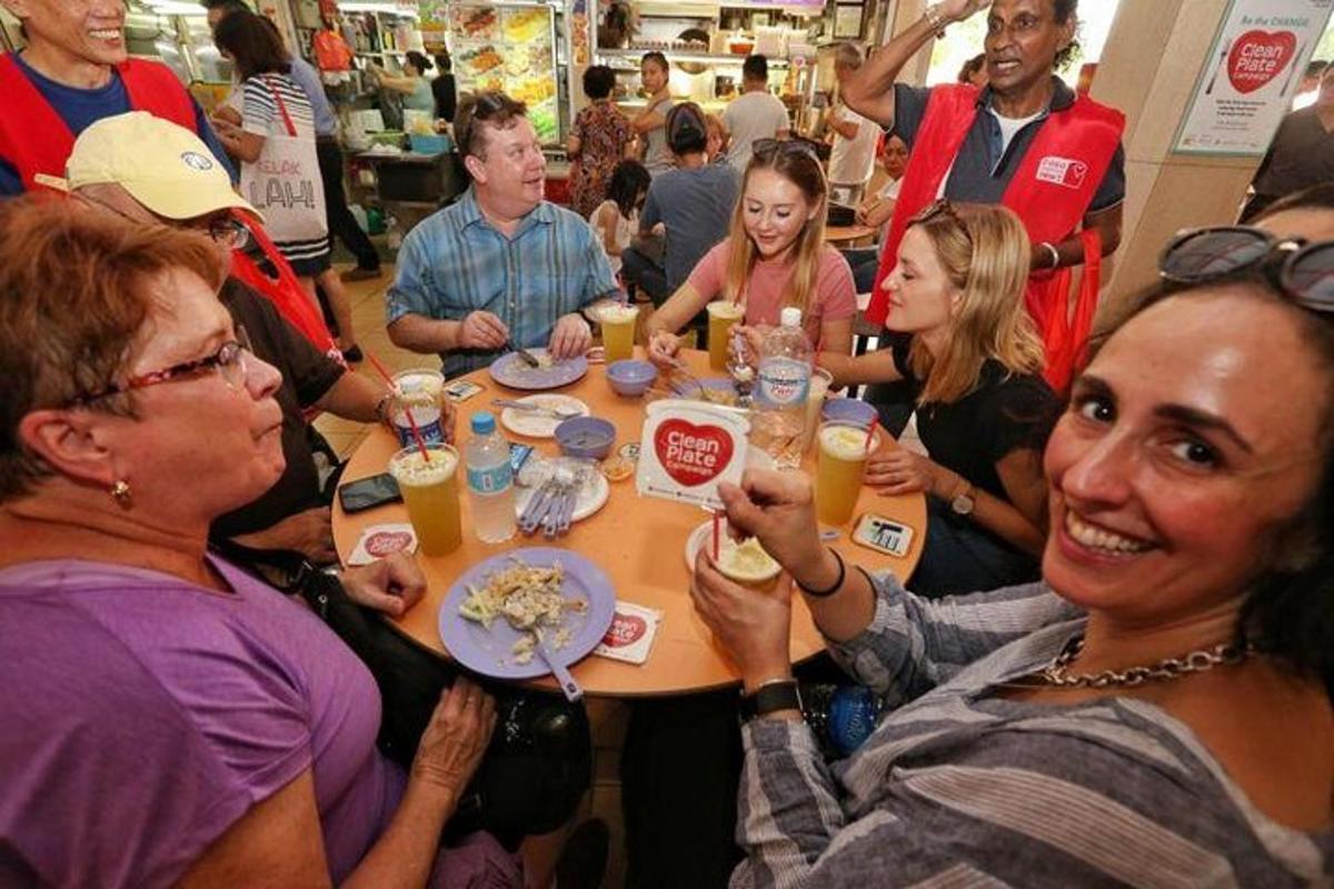 a group of people sitting around a table eating