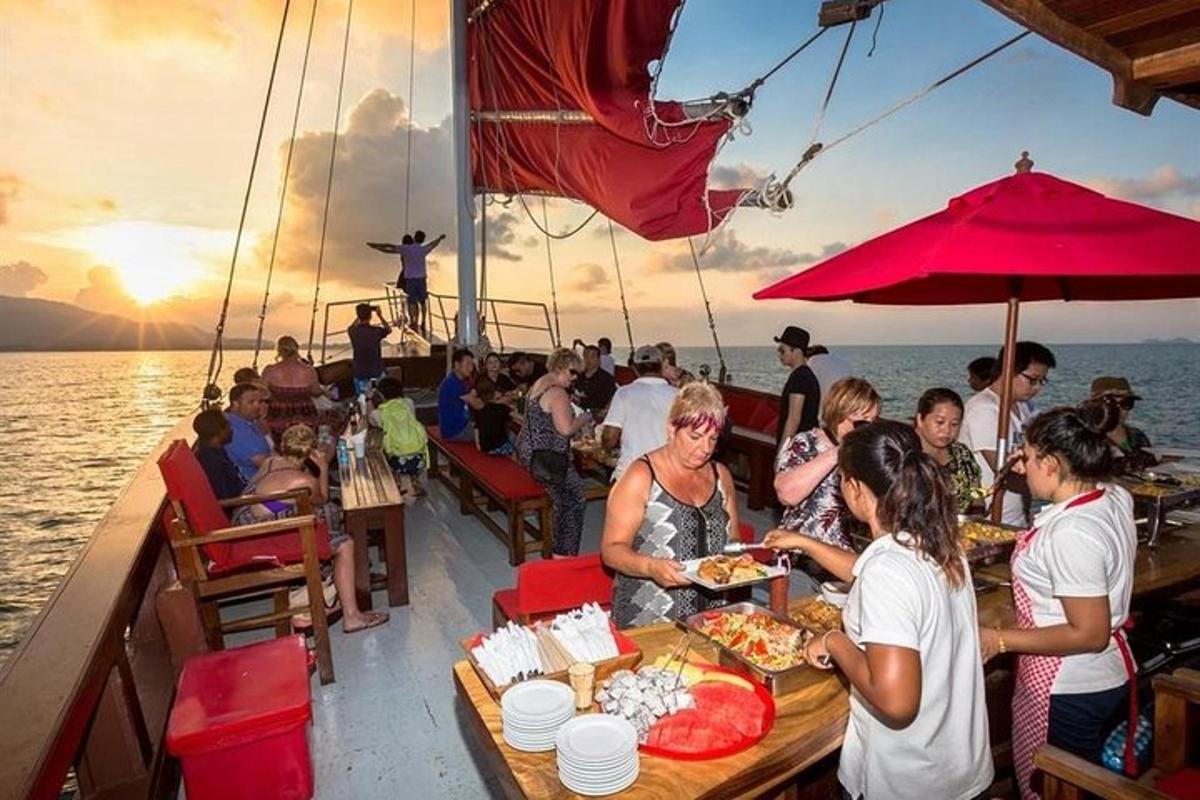 a group of people sitting at a table on a boat