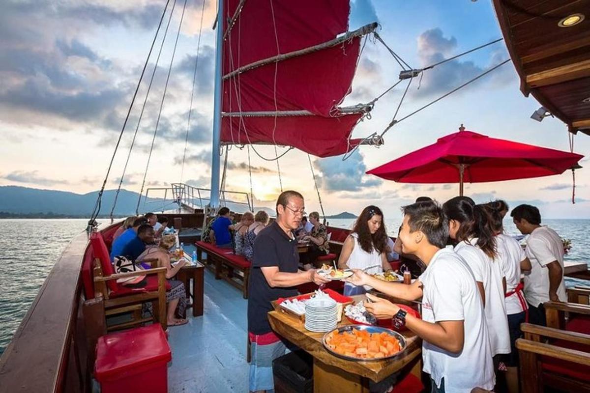 a group of people sitting at a table on a boat