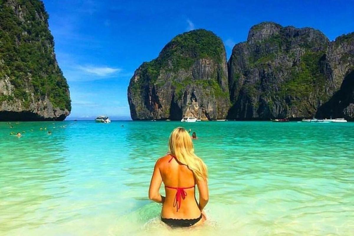 a woman in the water at a beach in the philippines