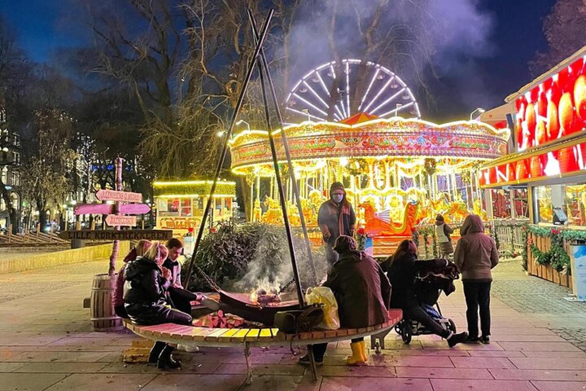 a group of people sitting on aousel at a carnival