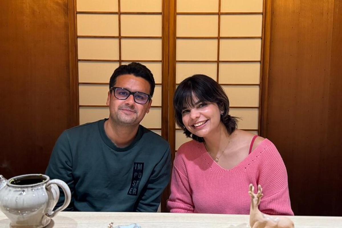 a man and a woman sitting at a table