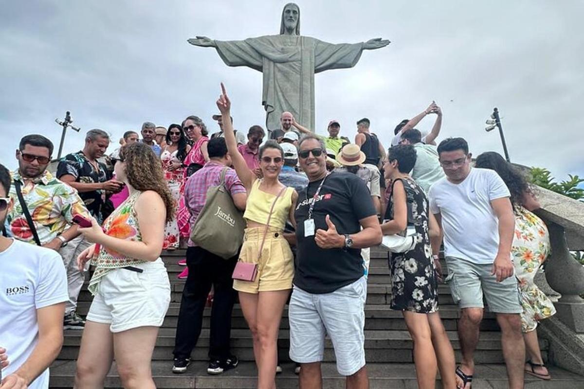 a group of people standing in front of a statue
