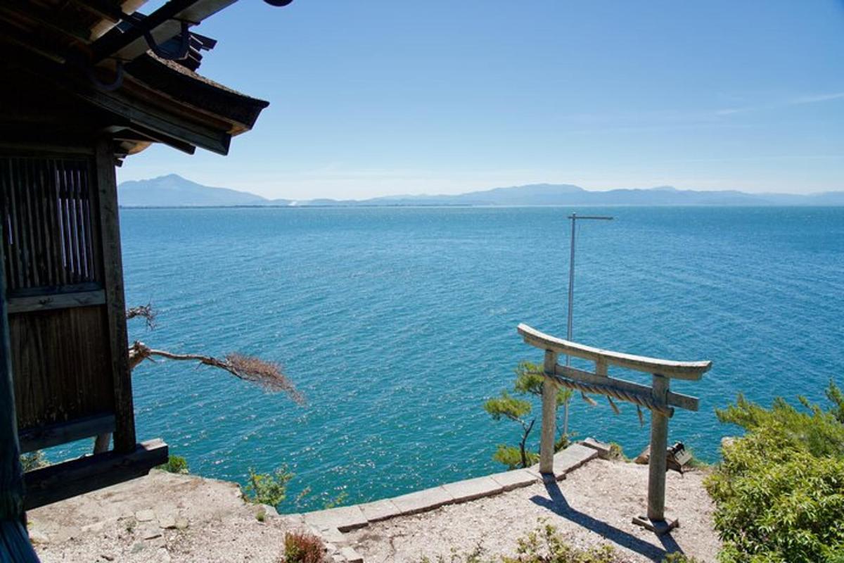a bench sitting on the side of a body of water