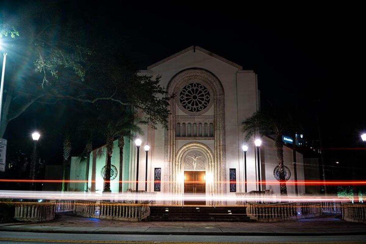 a building with a light trail in front of it at night
