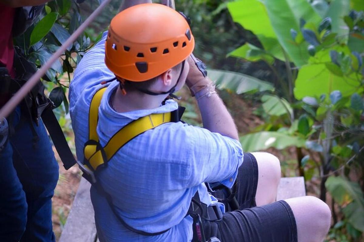 a man wearing a life vest and an orange helmet