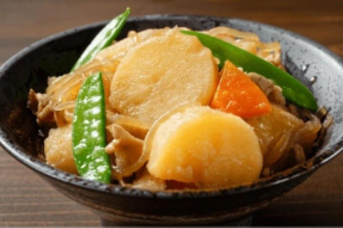 a bowl of food with meat and vegetables