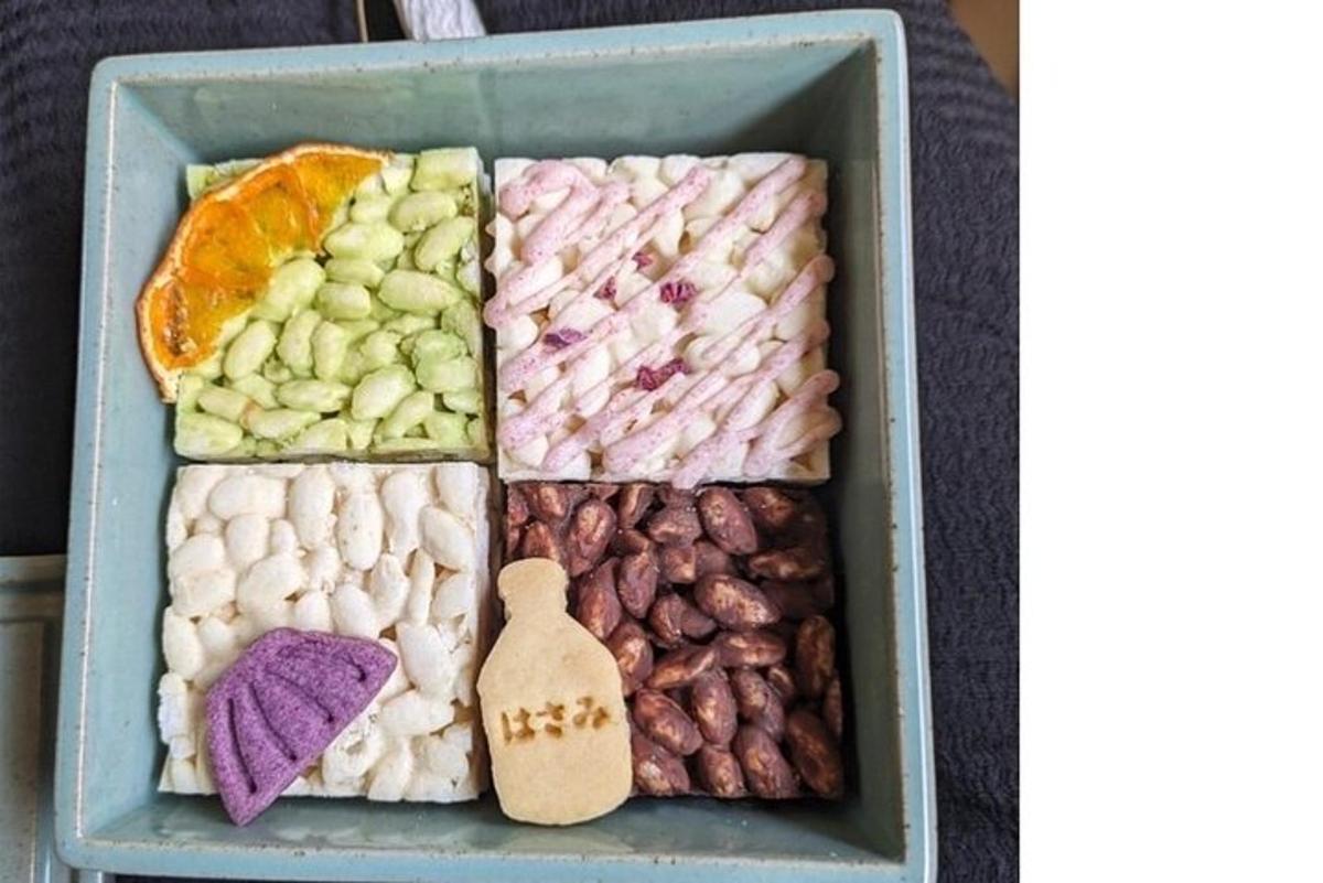a lunch box filled with different types of candies
