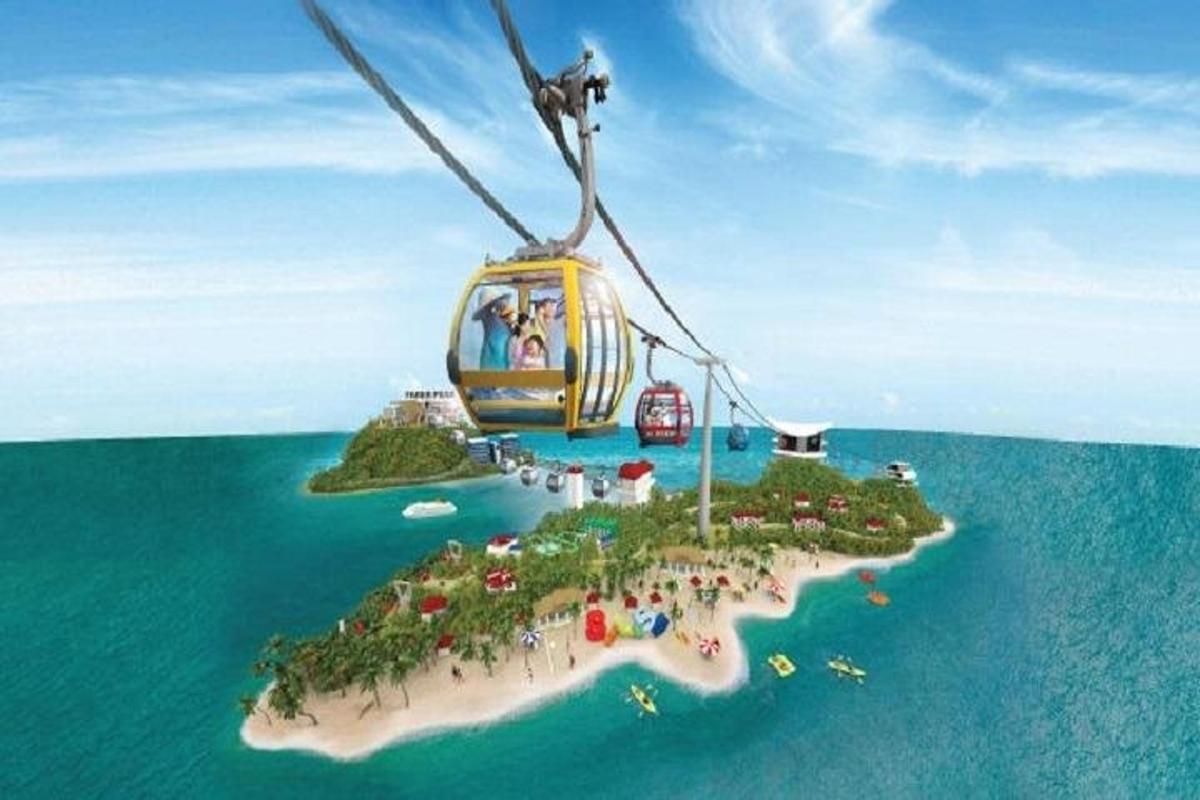 egy gondola repül egy sziget felett az óceánban