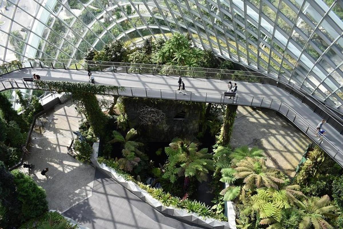 a walkway in a large building with people walking on it