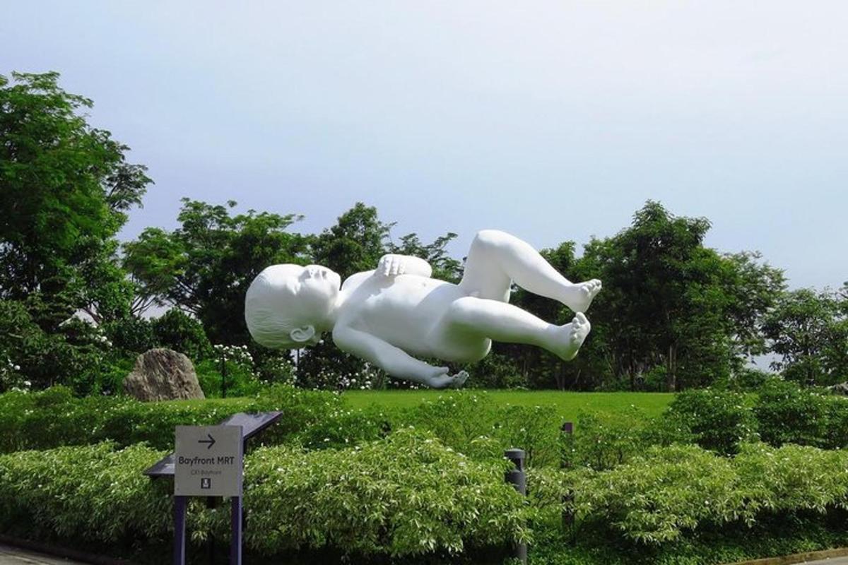 a statue of a person laying on the ground