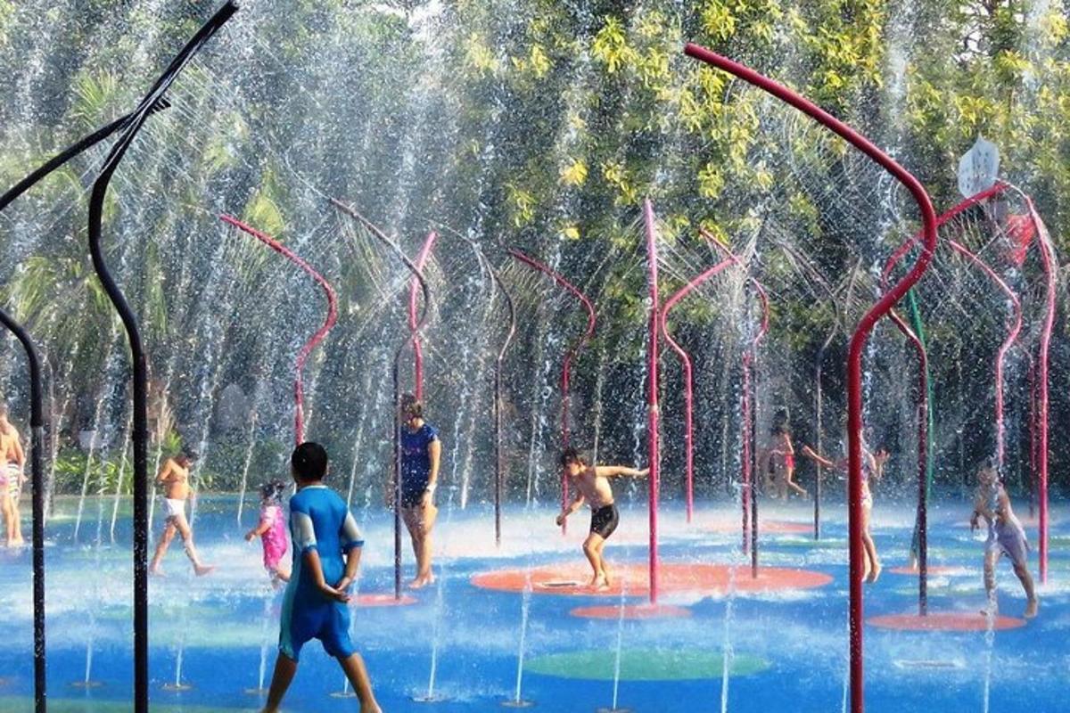 a group of people playing in a water park