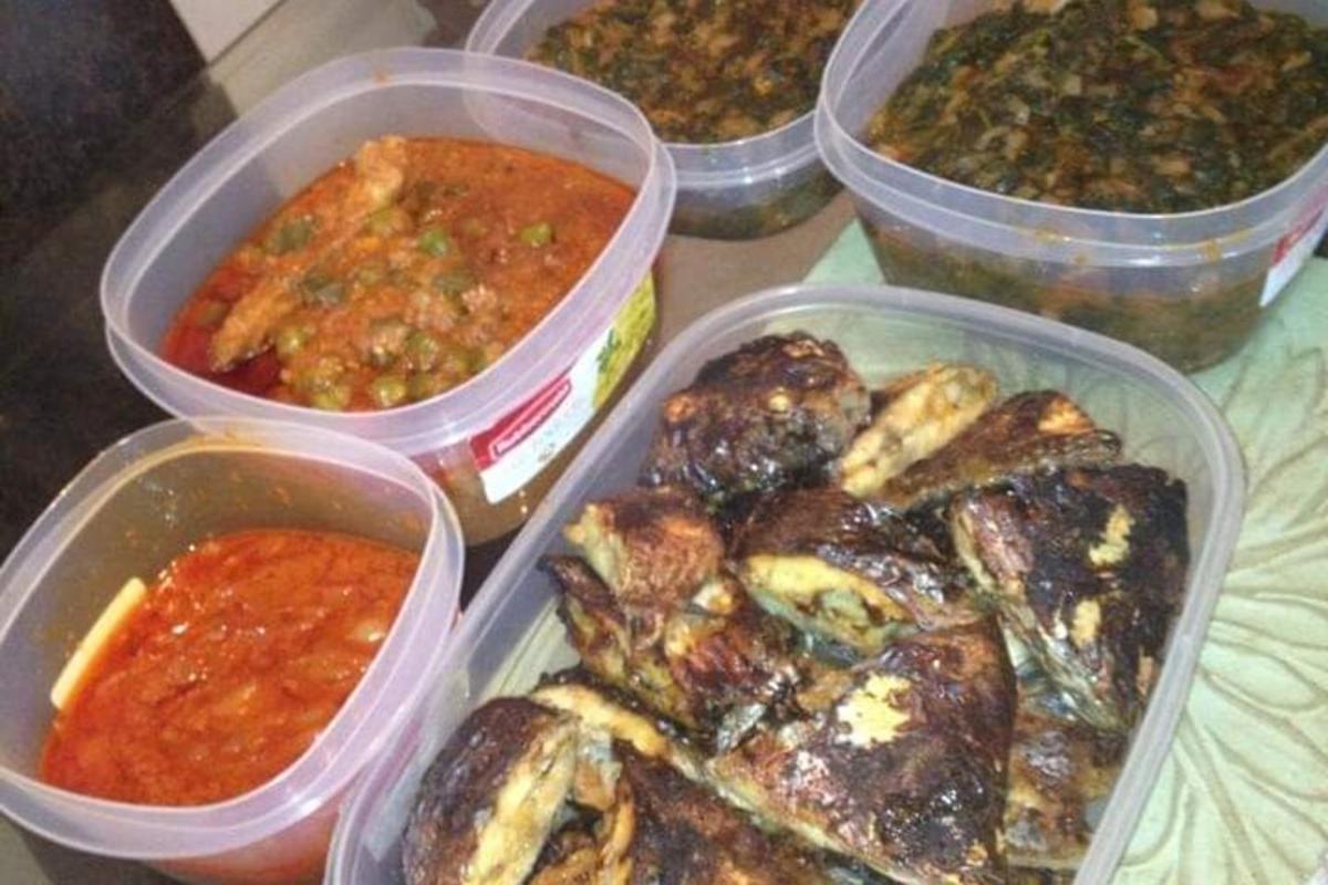 four plastic containers filled with different types of food