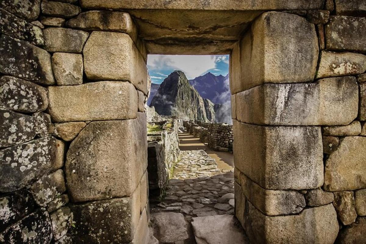 a stone wall with a view of a mountain