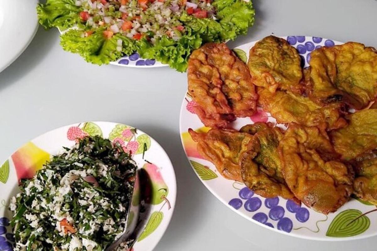 a table with two plates of food and a salad