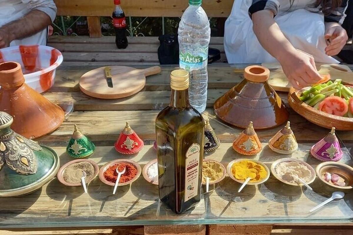 a bottle of wine sitting on a table with plates and bowls