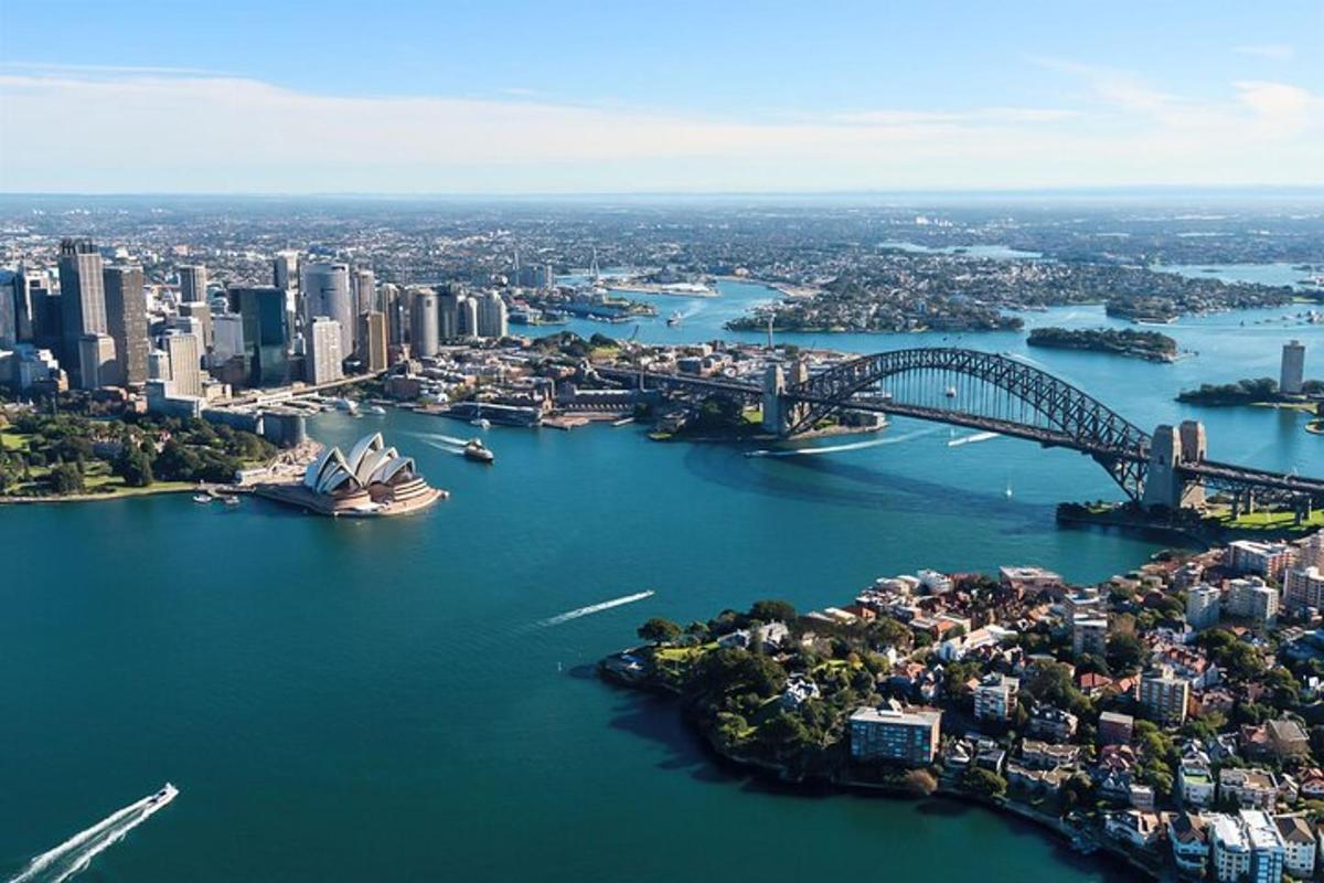 an aerial view of a city with a bridge and a harbor