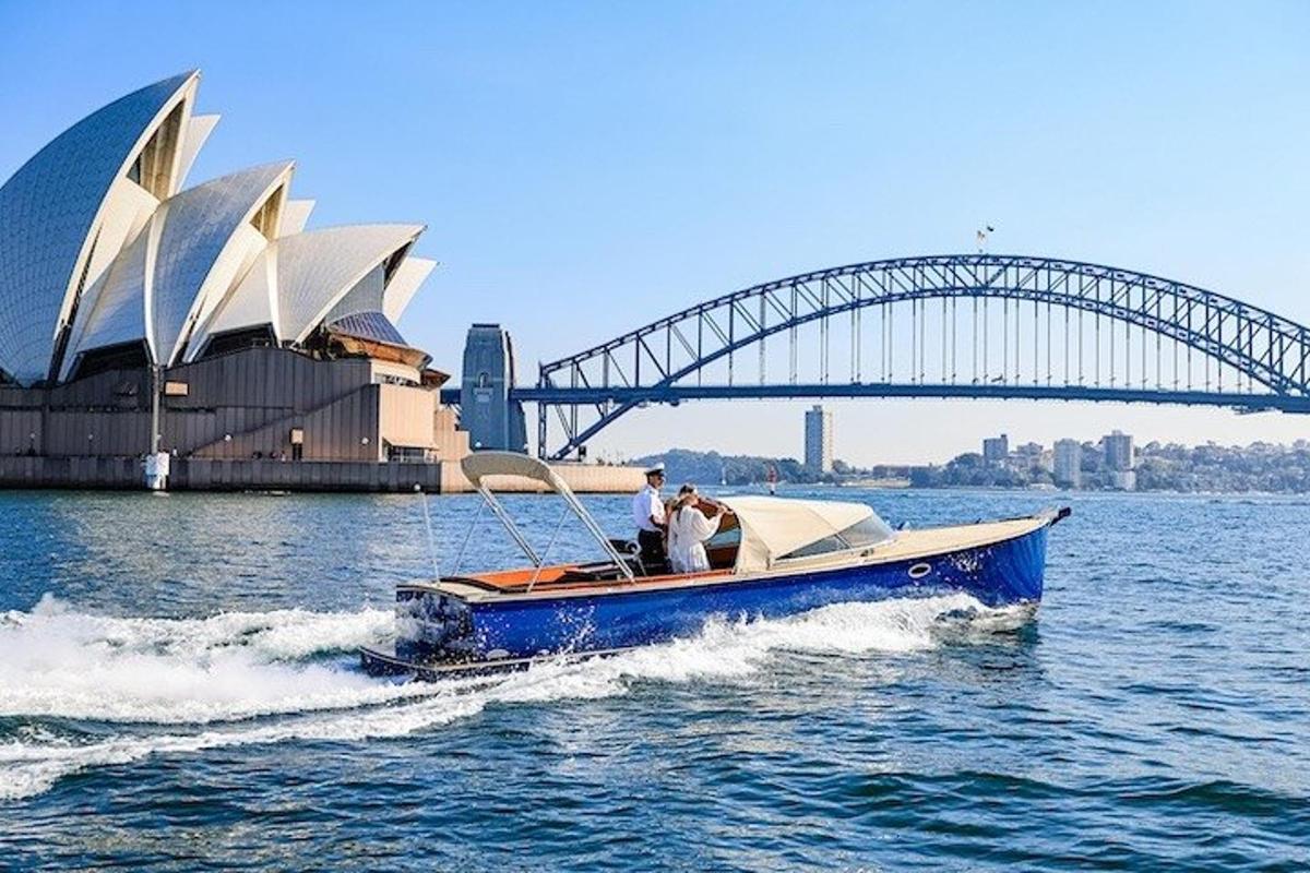 a boat in the water with a bridge in the background