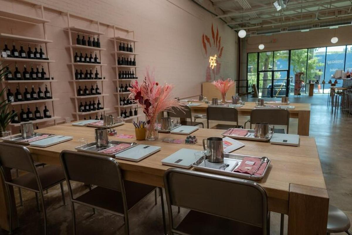 a large table in a room with chairs and wine bottles