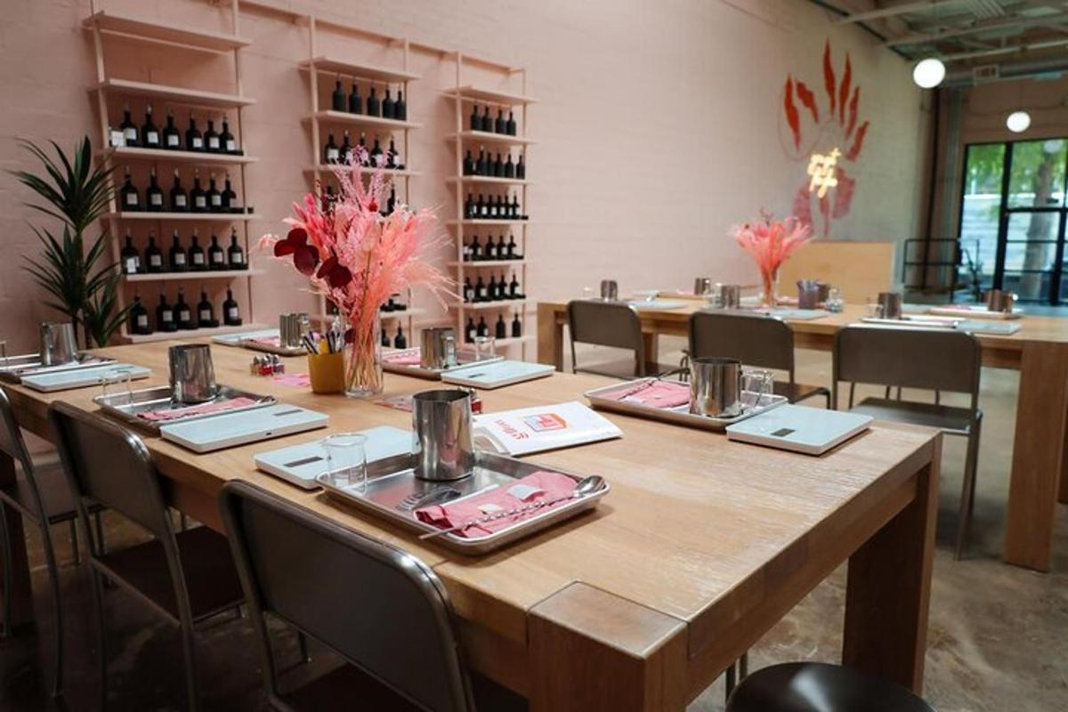 a large table in a room with chairs and wine bottles
