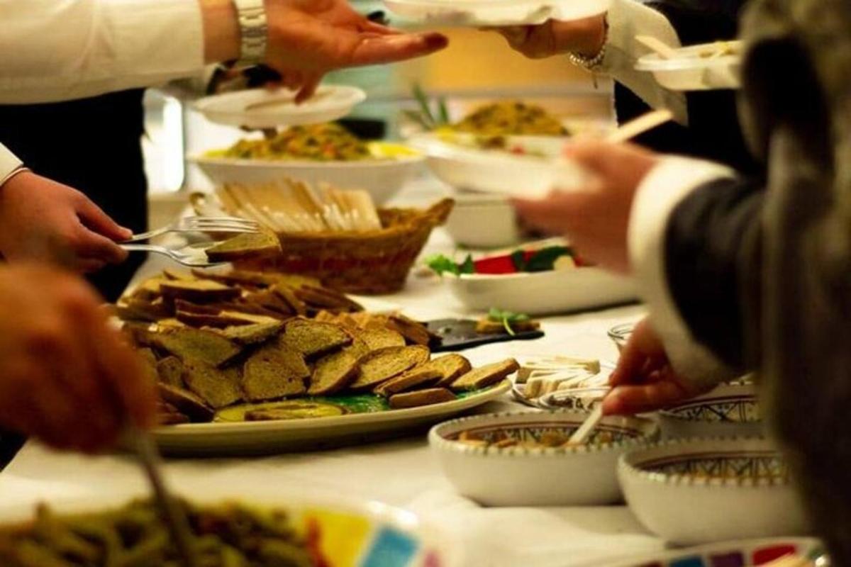 a group of people eating food on a table