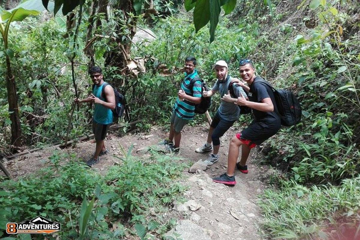 a group of men walking down a trail