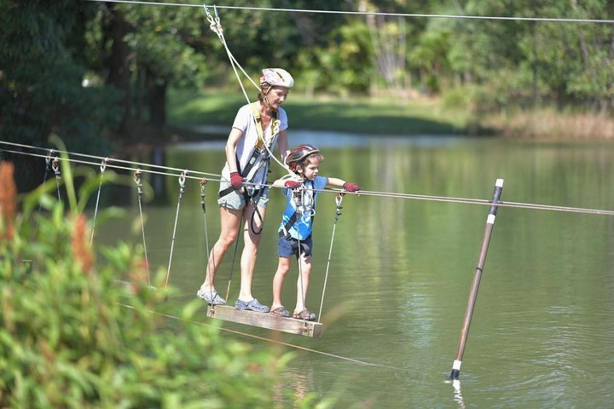 a woman and a child on a board in the water