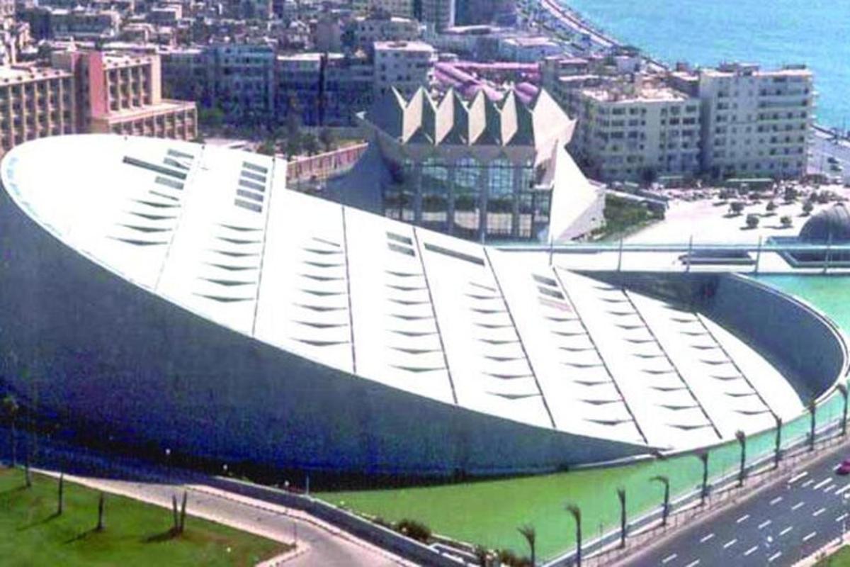 a large white building in the middle of a city