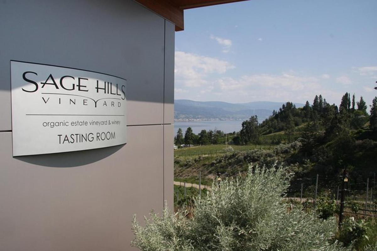 a sign on the side of a building with a view of a lake
