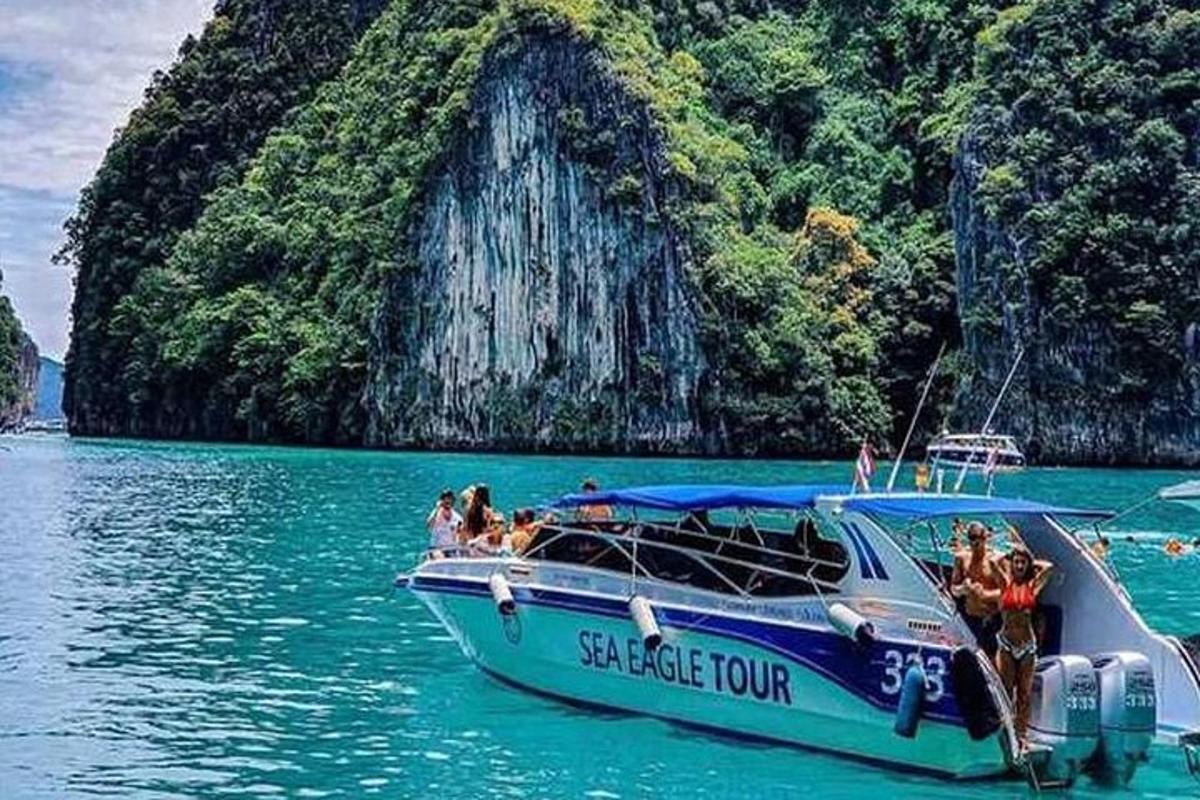 a group of people on a boat in the water