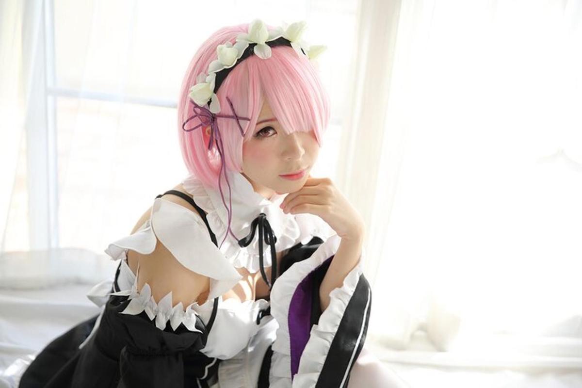 a girl with pink hair and a white shirt
