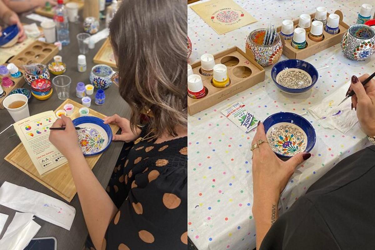 a woman sitting at a table with a bowl of cereal