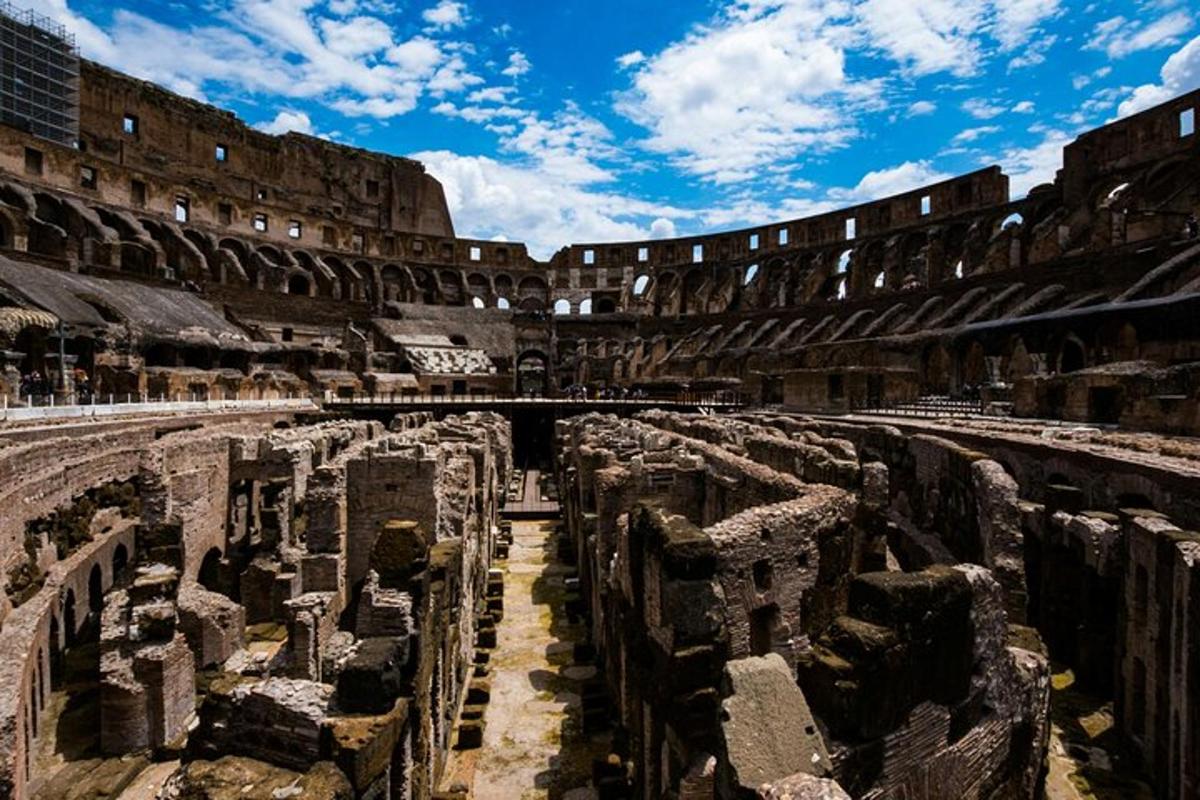 an empty amphitheater with a building in the background