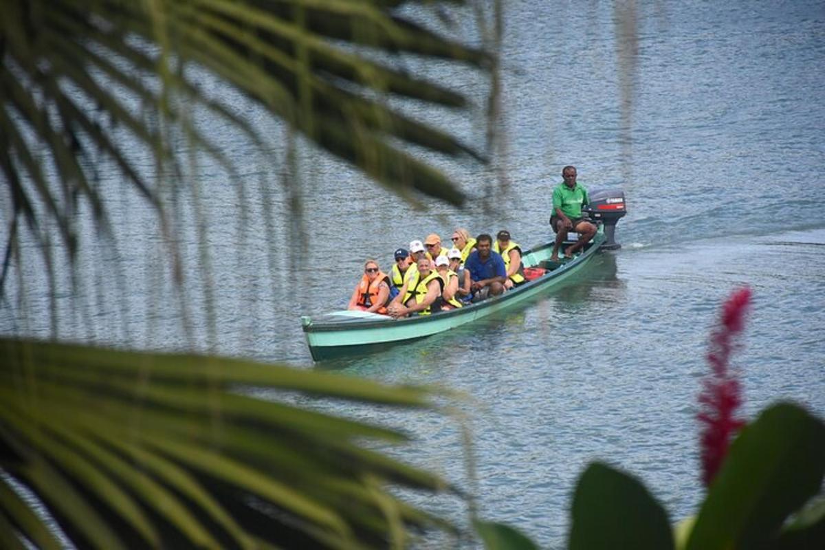 a group of people in a boat on the water