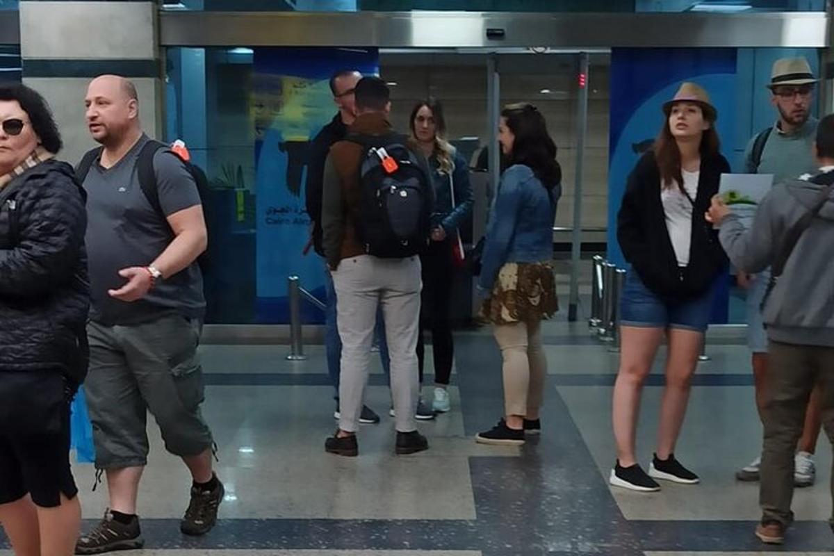 a group of people standing in a lobby