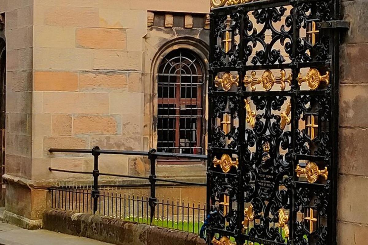 a black and gold door on the side of a building