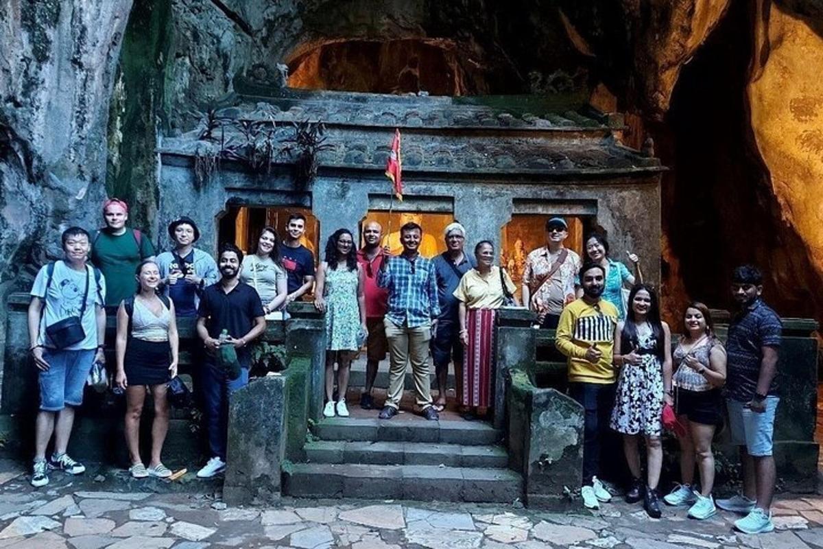 a group of people posing for a picture in front of a temple