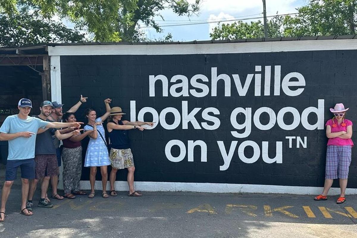 a group of people standing in front of a sign