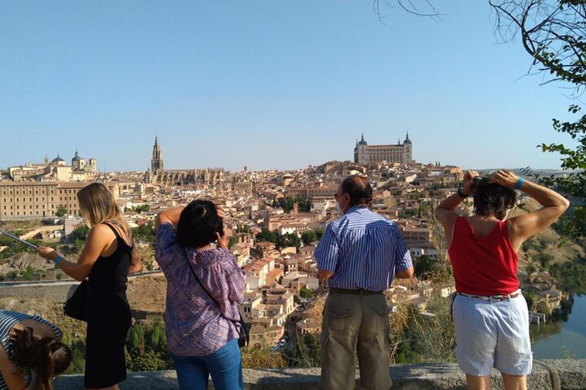 a group of people taking pictures of a city