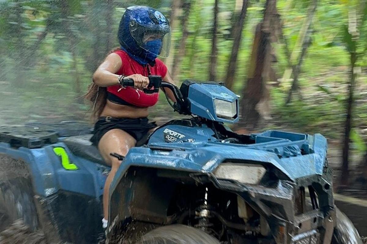 a woman riding a quad bike in the woods