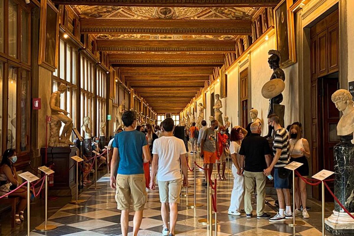 a group of people looking at art in a museum