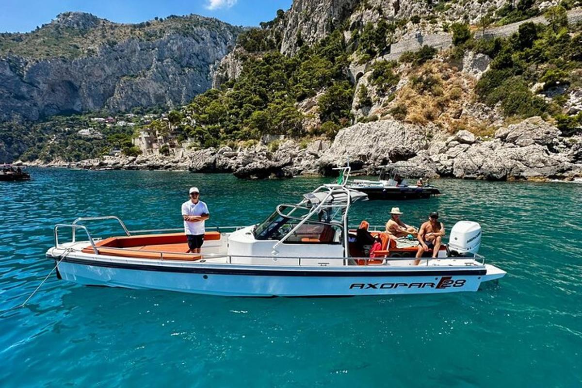 a group of people sitting on a boat in the water